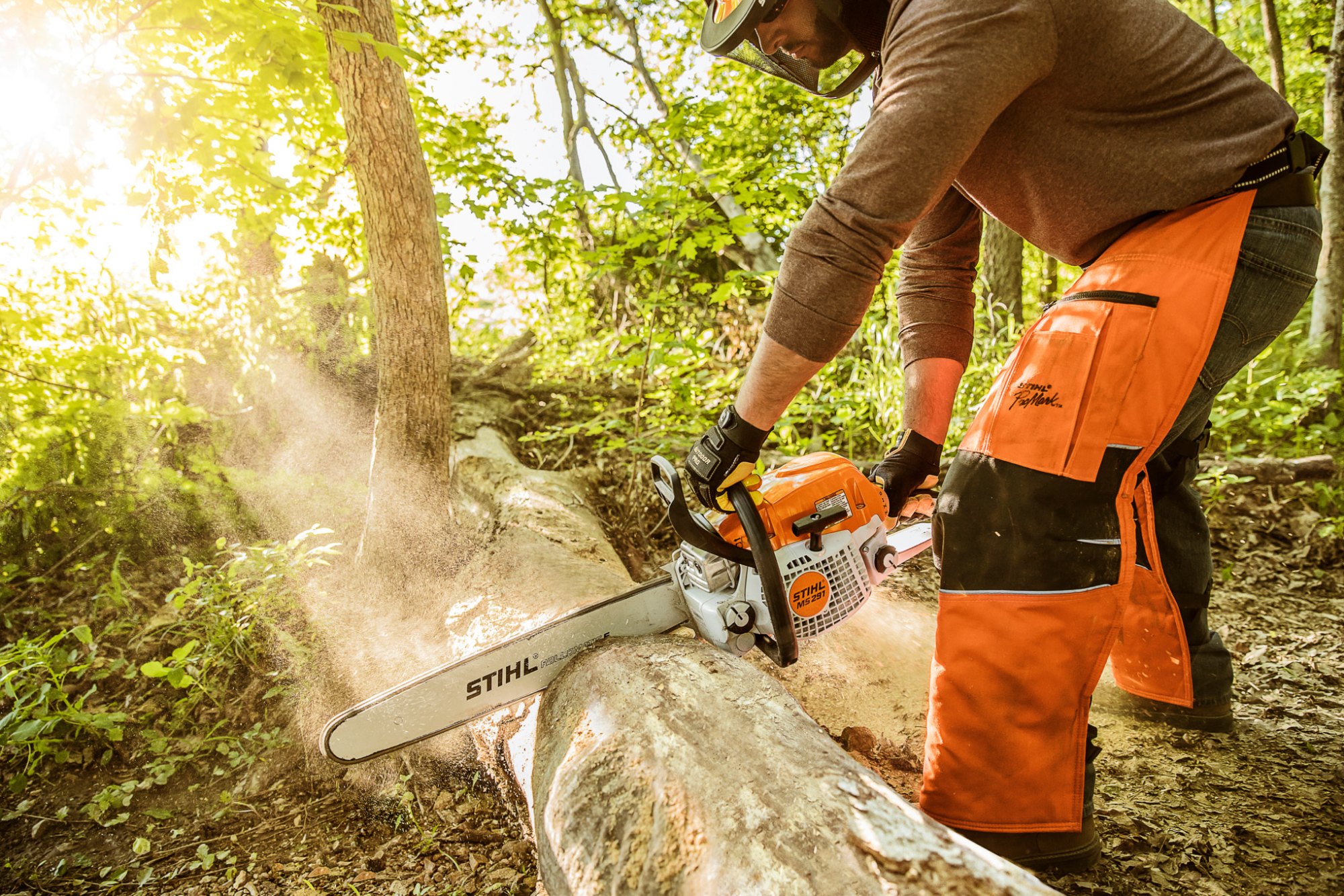 STIHL chainsaw cutting a log